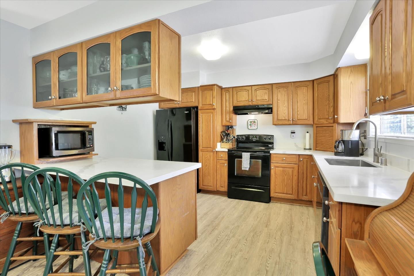 630 Paradise Road Salinas, CA 93907 - Photo 12 of 37 a kitchen with granite countertop stainless steel appliances and wooden cabinets