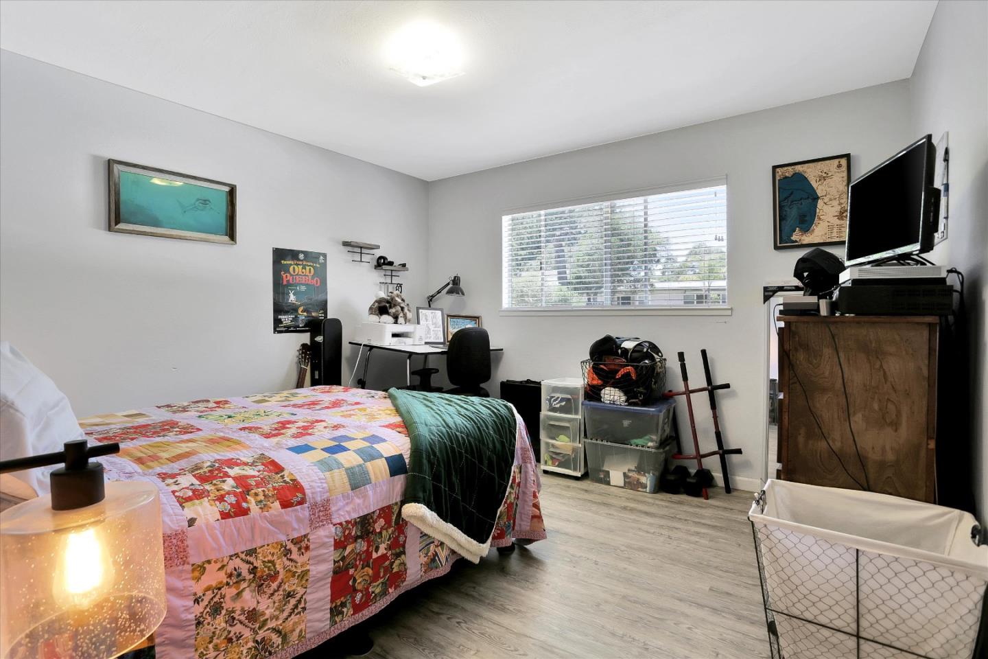 630 Paradise Road Salinas, CA 93907 - Photo 22 of 37 a bedroom with a bed and a flat tv screen on the dresser