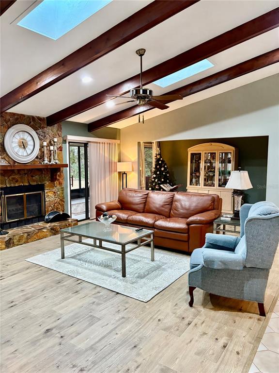 19807 Southwest 85th Loop Dunnellon, FL 34432 - Photo 12 of 60 a living room with furniture and a fireplace