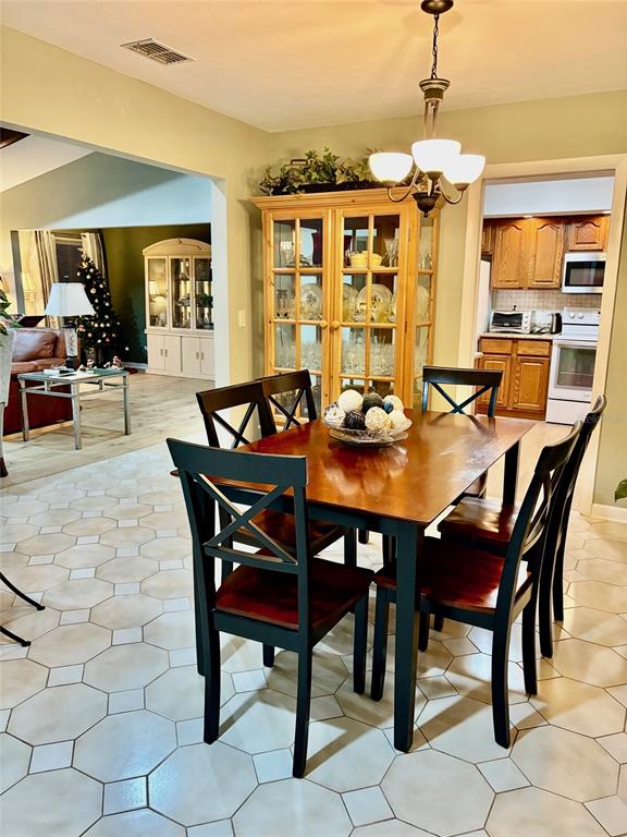 19807 Southwest 85th Loop Dunnellon, FL 34432 - Photo 17 of 60 a view of a dining room with furniture