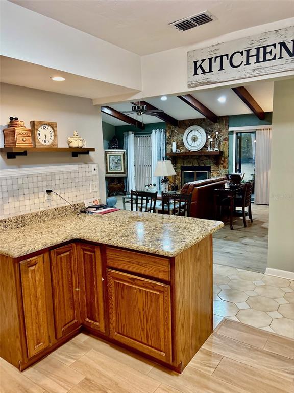 19807 Southwest 85th Loop Dunnellon, FL 34432 - Photo 18 of 60 a kitchen with stainless steel appliances granite countertop a sink and cabinets