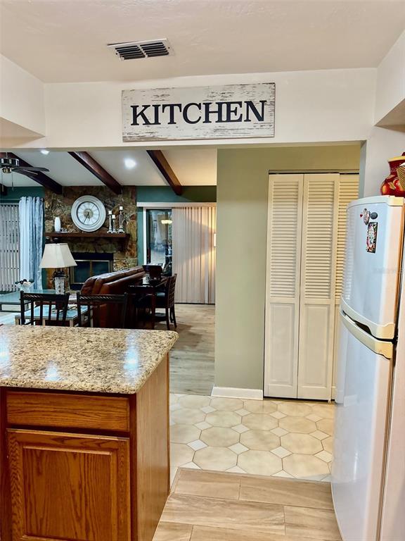 19807 Southwest 85th Loop Dunnellon, FL 34432 - Photo 19 of 60 a kitchen with stainless steel appliances granite countertop a sink and a refrigerator