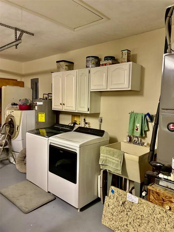 19807 Southwest 85th Loop Dunnellon, FL 34432 - Photo 24 of 60 a view of a kitchen with sink and wooden floor