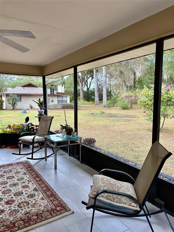 19807 Southwest 85th Loop Dunnellon, FL 34432 - Photo 26 of 60 a living room with large window