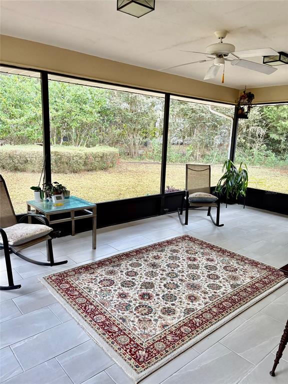 19807 Southwest 85th Loop Dunnellon, FL 34432 - Photo 27 of 60 a living room with couch and a large window