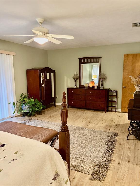 19807 Southwest 85th Loop Dunnellon, FL 34432 - Photo 30 of 60 a bedroom with a bed and window