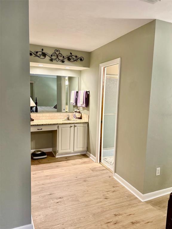 19807 Southwest 85th Loop Dunnellon, FL 34432 - Photo 35 of 60 a bedroom with a bed and a view of kitchen