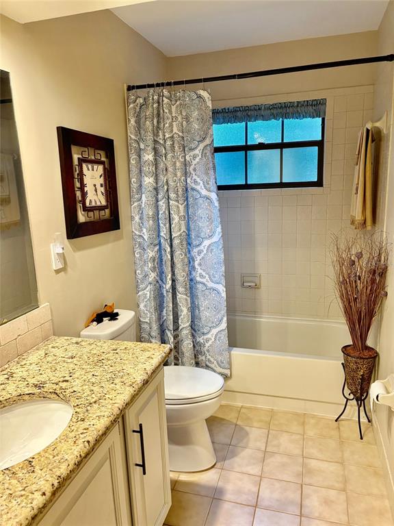 19807 Southwest 85th Loop Dunnellon, FL 34432 - Photo 40 of 60 a bathroom with a granite countertop sink toilet and shower