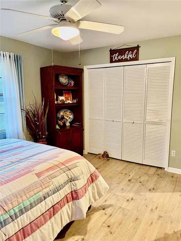 19807 Southwest 85th Loop Dunnellon, FL 34432 - Photo 43 of 60 a bedroom with a bed and a walk in closet