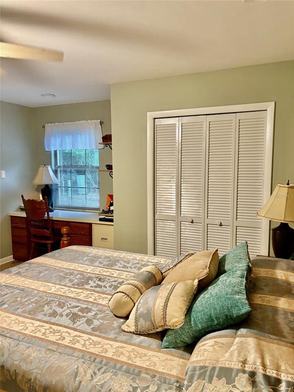 19807 Southwest 85th Loop Dunnellon, FL 34432 - Photo 48 of 60 a bedroom with two beds and a window