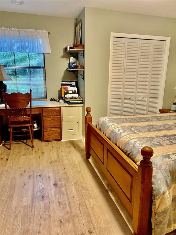 19807 Southwest 85th Loop Dunnellon, FL 34432 - Photo 49 of 60 a bed sitting in a bedroom next to a window