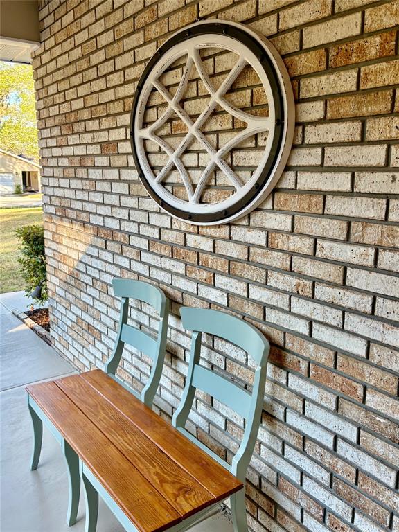 19807 Southwest 85th Loop Dunnellon, FL 34432 - Photo 5 of 60 a view of a wooden bench with chairs in it