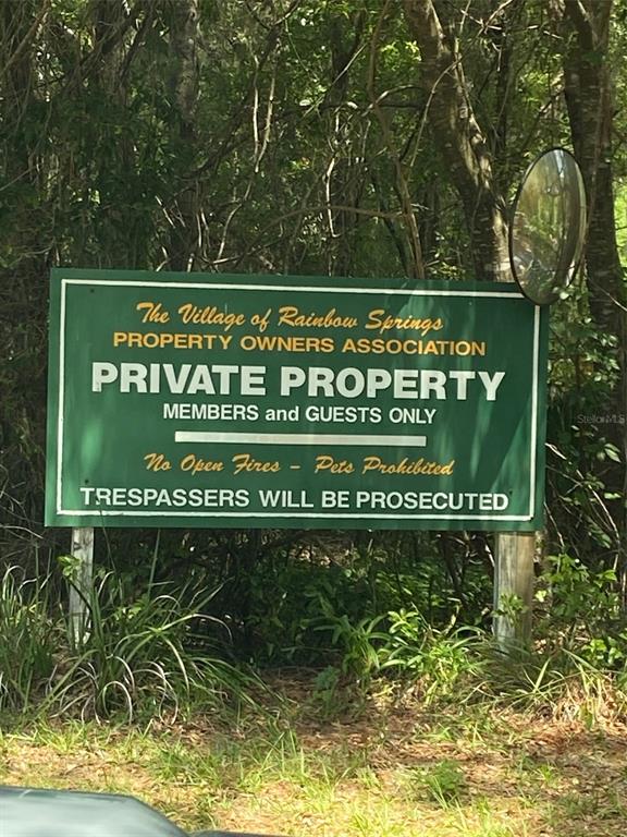 19807 Southwest 85th Loop Dunnellon, FL 34432 - Photo 52 of 60 a street sign that is on a wooden wall