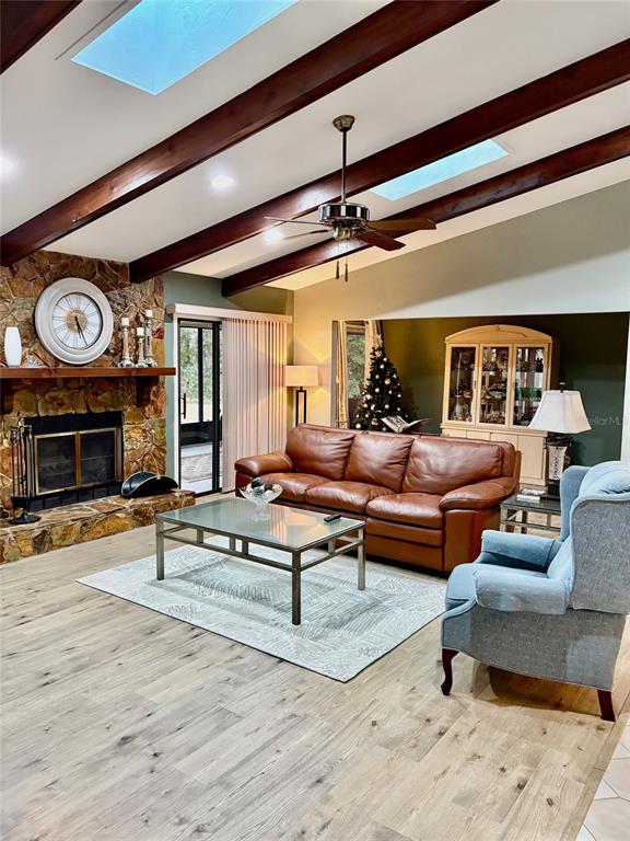 19807 Southwest 85th Loop Dunnellon, FL 34432 - Photo 7 of 60 a living room with furniture and a fireplace