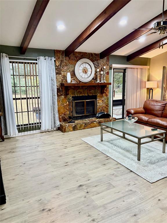 19807 Southwest 85th Loop Dunnellon, FL 34432 - Photo 8 of 60 a view of an empty room with a fireplace and window