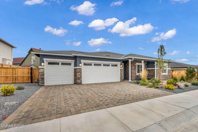 a living room with furniture fireplace and window