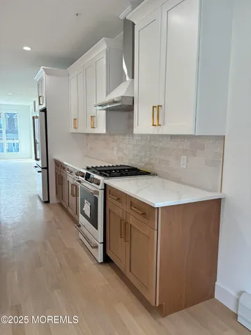 a kitchen with a sink and a stove