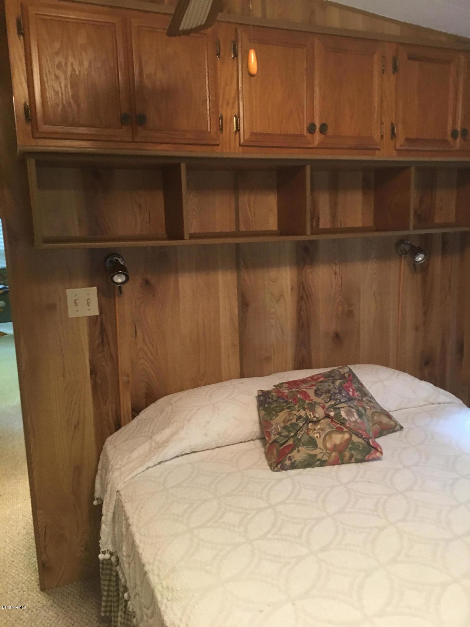 7 North Main Road Otis, MA 01253 - Photo 15 of 24 a bedroom with a bed and cabinets