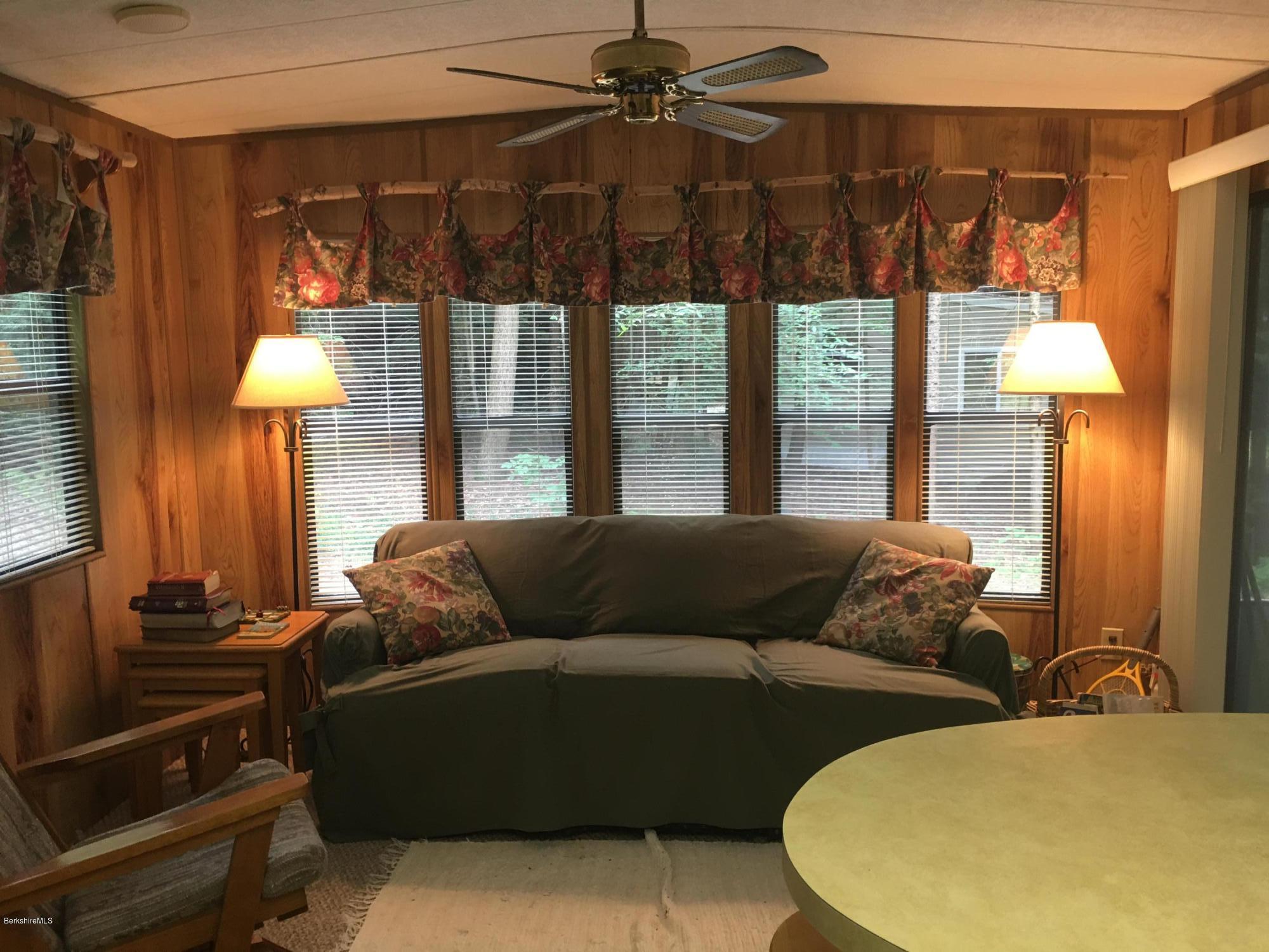 7 North Main Road Otis, MA 01253 - Photo 22 of 24 a living room with furniture and a lamp