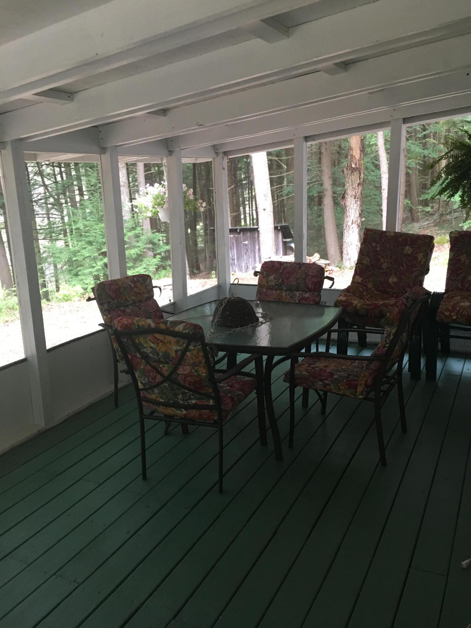 7 North Main Road Otis, MA 01253 - Photo 23 of 24 a view of a dining room with furniture window and outside view