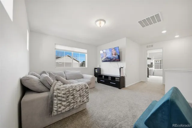 a living room with furniture and a couch