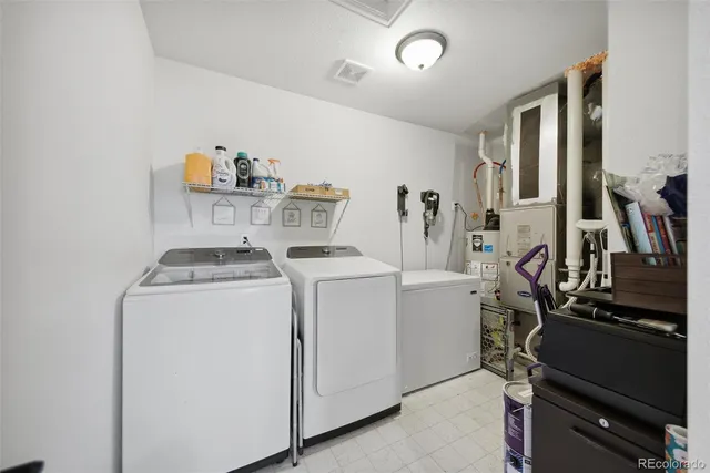 a view of storage and utility room with washer and dryer