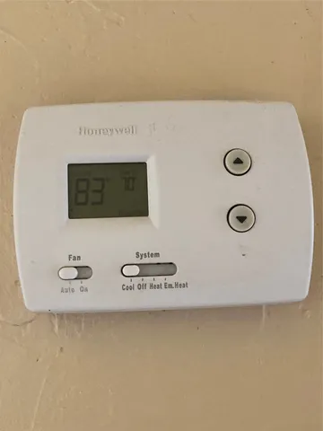 a white toilet sitting next to a bath tub