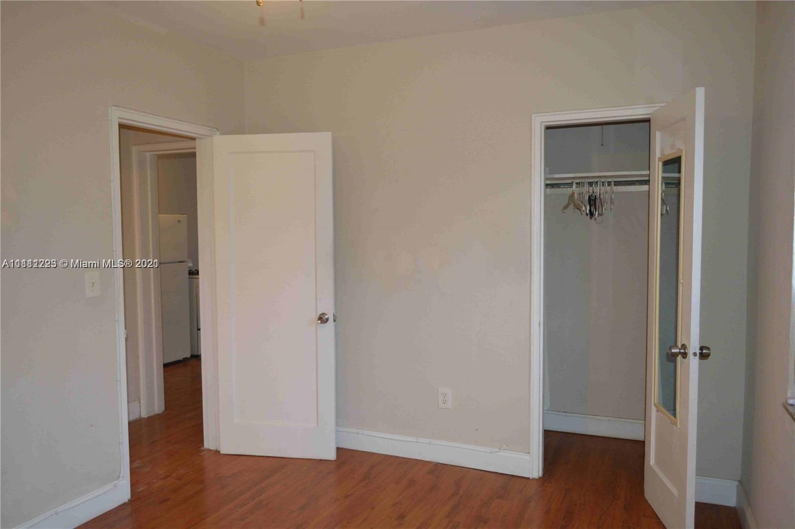 635 83rd Street, Unit 47 Miami Beach, FL 33141 - Photo 13 of 16 a view of an empty room with wooden floor