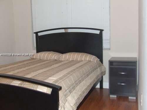 635 83rd Street, Unit 47 Miami Beach, FL 33141 - Photo 5 of 16 a bedroom with a bed and a closet