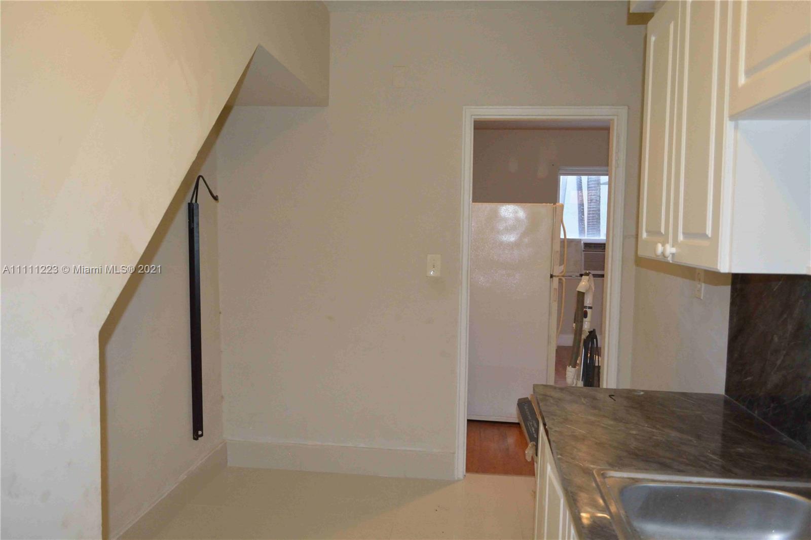 635 83rd Street, Unit 47 Miami Beach, FL 33141 - Photo 7 of 16 a bathroom with a granite countertop sink