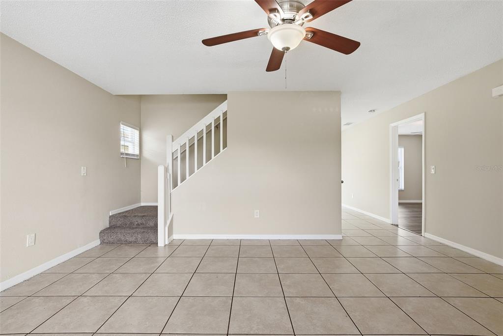 617 Greys Ferry Road Orlando, FL 32811 - Photo 10 of 35 a view of an empty room and chandelier fan
