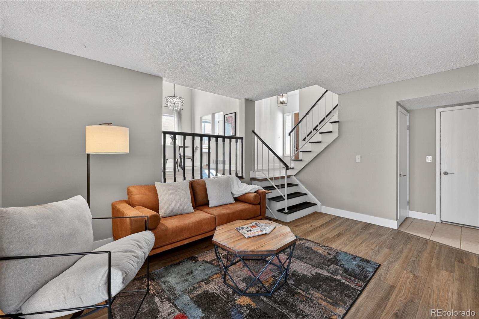 7586 Chase Street Arvada, CO 80003 - Photo 15 of 35 a bedroom with furniture and wooden floor