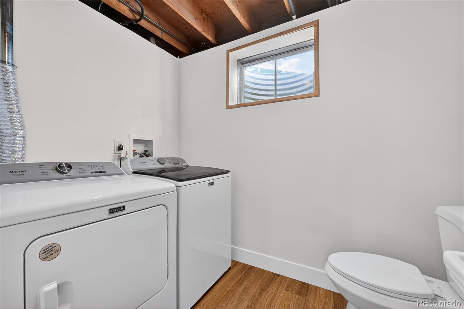 7586 Chase Street Arvada, CO 80003 - Photo 31 of 35 a bathroom with a toilet and a sink