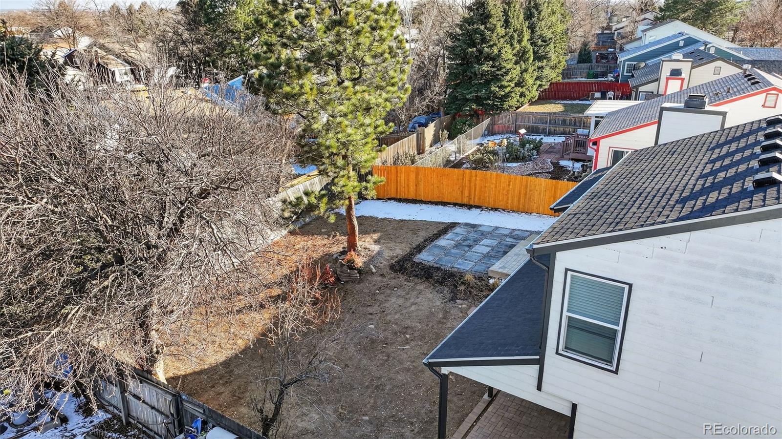 7586 Chase Street Arvada, CO 80003 - Photo 33 of 35 a view of a backyard with a house