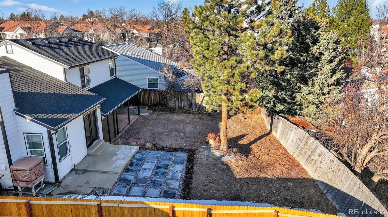 7586 Chase Street Arvada, CO 80003 - Photo 34 of 35 a view of a house with a yard