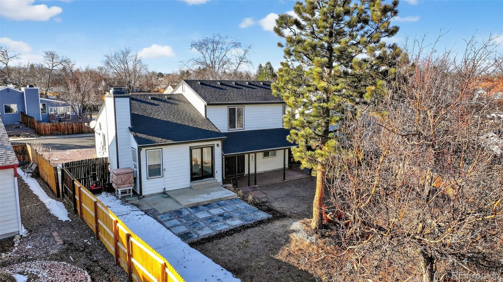 7586 Chase Street Arvada, CO 80003 - Photo 35 of 35 a view of a house with roof deck