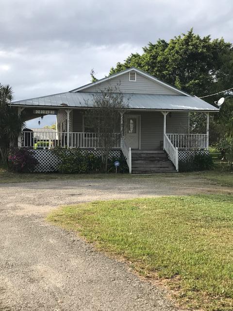 2245 Bacom Point Road Pahokee, FL 33476 - Photo 14 of 24 Front Exterior Front Lot Home