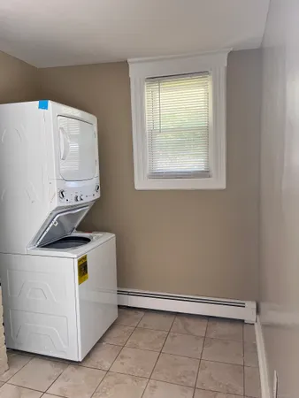 a stove top oven sitting inside of a kitchen