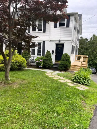 a view of a house with a yard