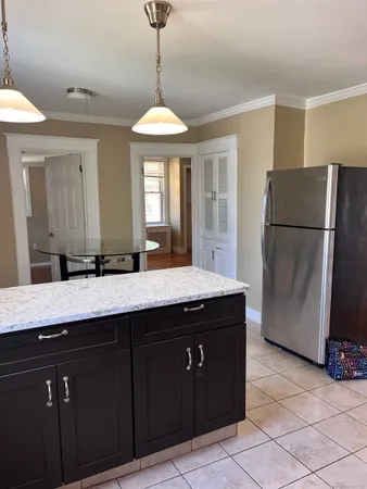 a kitchen with a refrigerator a sink and dishwasher