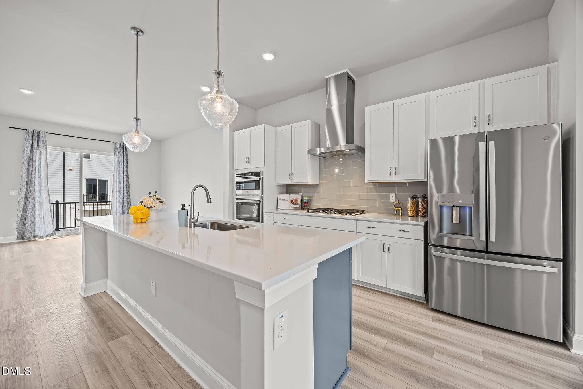 501 Hedrick Ridge Road Cary, NC 27519 - Photo 13 of 47 a kitchen with refrigerator cabinets and wooden floor
