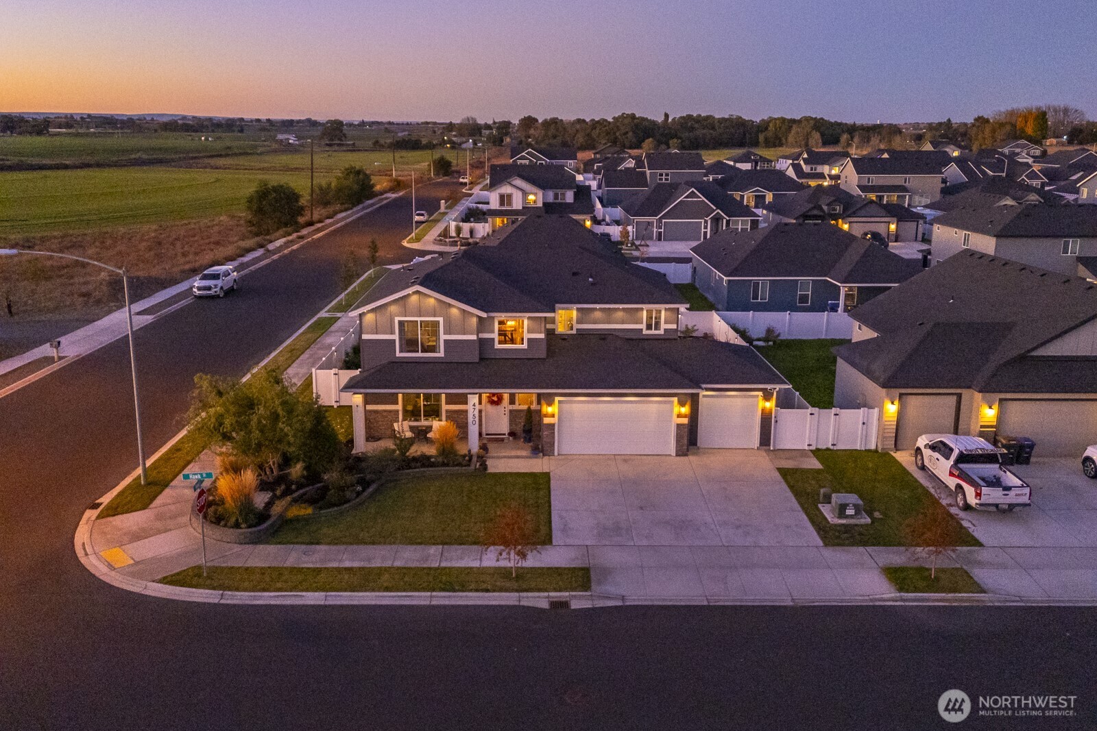 an aerial view of a house with a ocean view