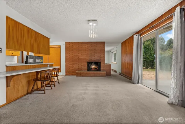 a view of a livingroom with furniture and a fireplace
