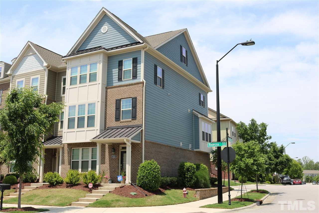 1325 Rodessa Run Raleigh, NC 27607 - Photo 1 of 25 a front view of a residential apartment building with a yard