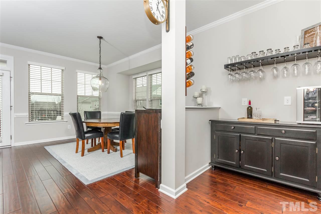 1325 Rodessa Run Raleigh, NC 27607 - Photo 11 of 25 a view of a dining room with furniture window and wooden floor