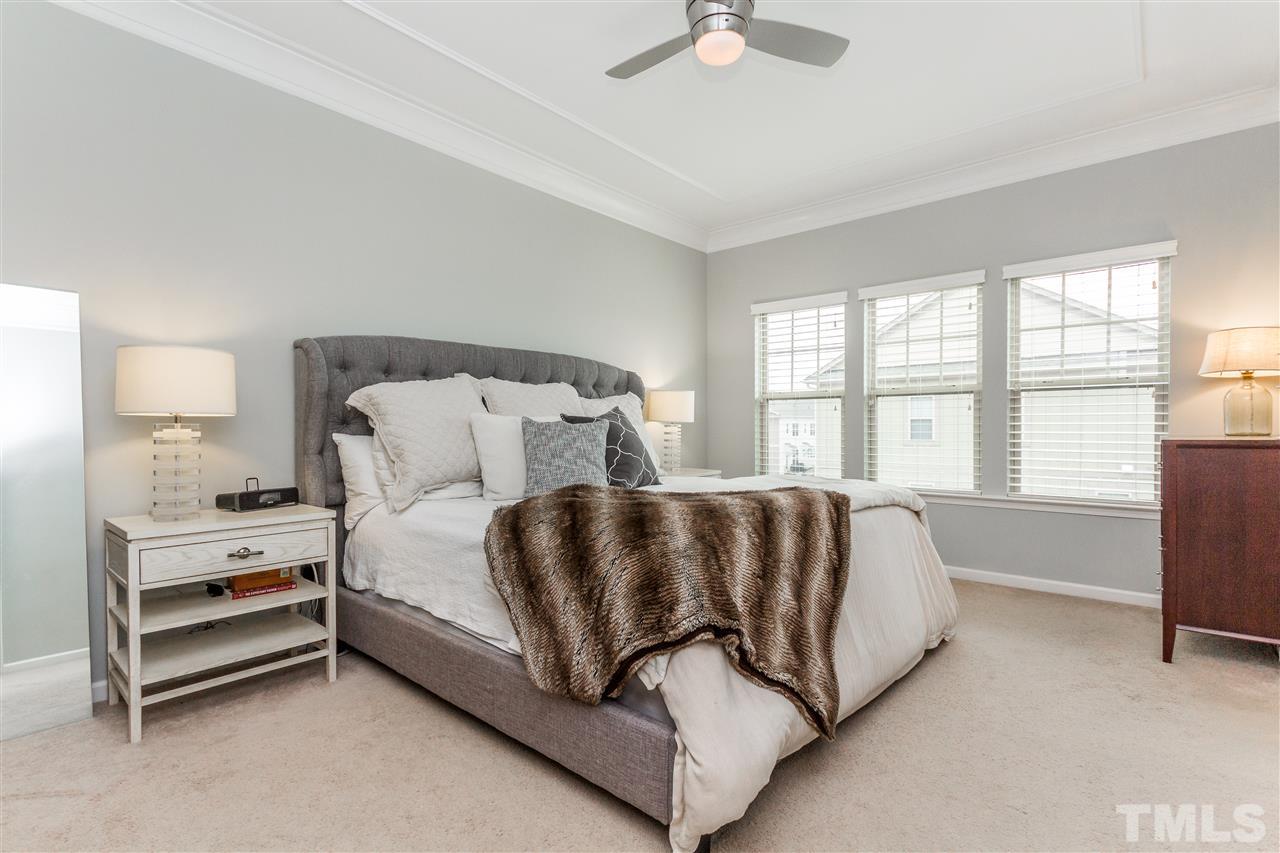 1325 Rodessa Run Raleigh, NC 27607 - Photo 15 of 25 a bed sitting in a bedroom next to a window