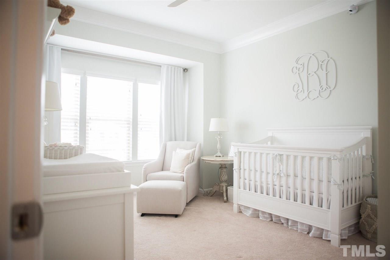 1325 Rodessa Run Raleigh, NC 27607 - Photo 21 of 25 a bedroom with a bed and a window