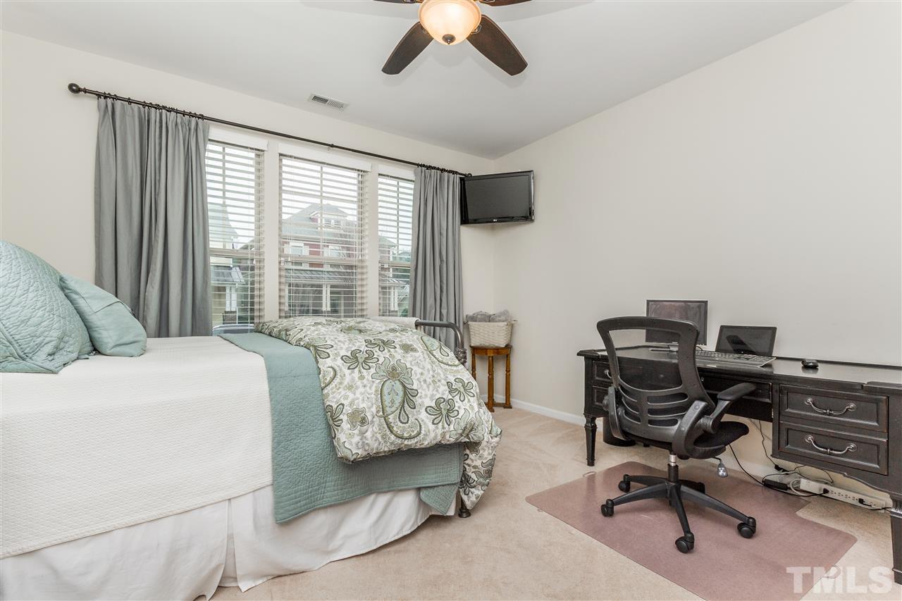 1325 Rodessa Run Raleigh, NC 27607 - Photo 23 of 25 a bedroom with furniture and a large window