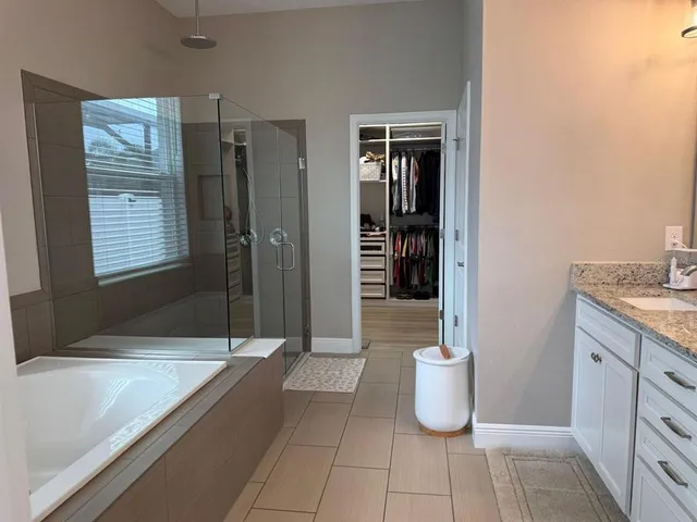 a bathroom with a toilet sink and shower