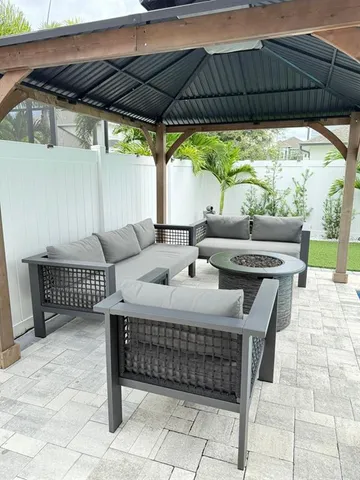 a kitchen with granite countertop a sink stainless steel appliances and cabinets